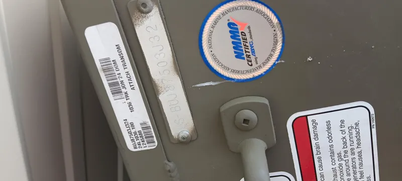 Slide: The Image of 2024 Tracker Grizzly 1036 Jon boat identification and certification labels. - 15