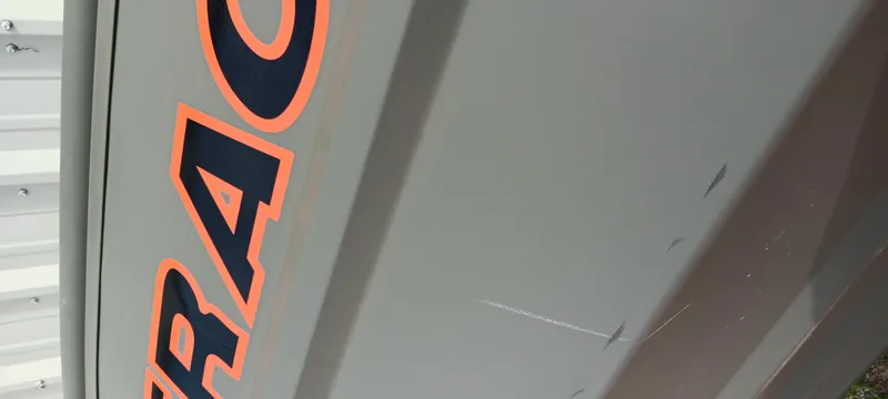 Slide: The Image of 2024 Tracker Grizzly 1036 Jon boat with bold lettering on the side. - 4