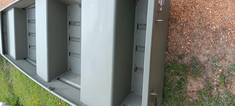 Slide: The Image of 2024 Tracker Grizzly 1036 Jon boat on grass and gravel surface. - 5