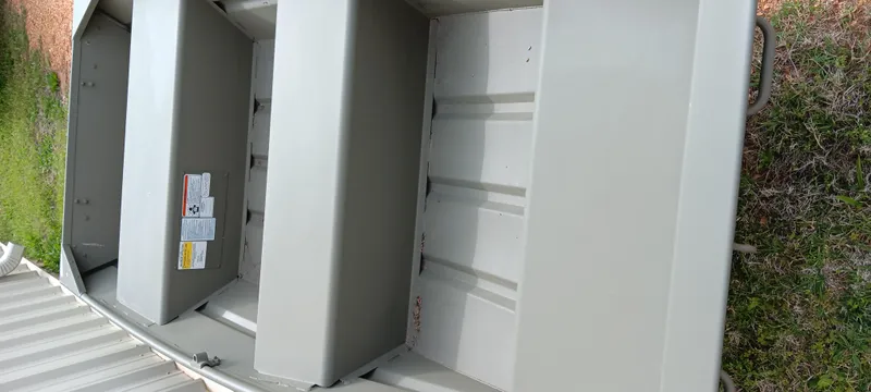 Slide: The Image of 2024 Tracker Grizzly 1036 Jon boat interior, showcasing seating and storage compartments. - 7