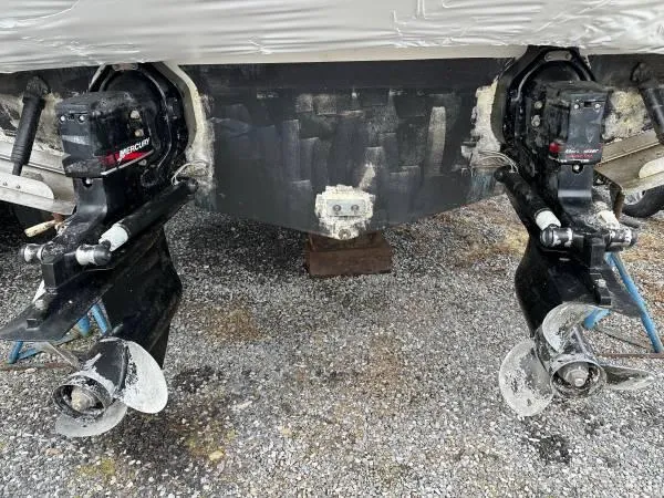 Slide: The Image of 2002 Bayliner 3055 Ciera boat with dual MerCruiser outdrives on gravel surface. - 22