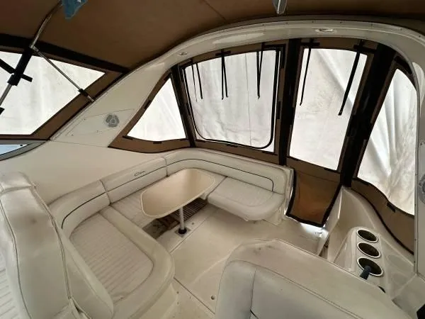 Slide: The Image of 2002 Bayliner 3055 Ciera interior with beige seating and windows. - 6