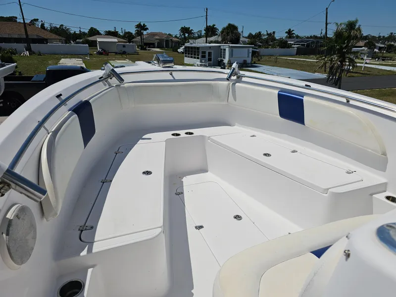 Slide: The Image of 2008 Pro-Line 29 Grande Sport boat interior with seating and storage compartments. - 10