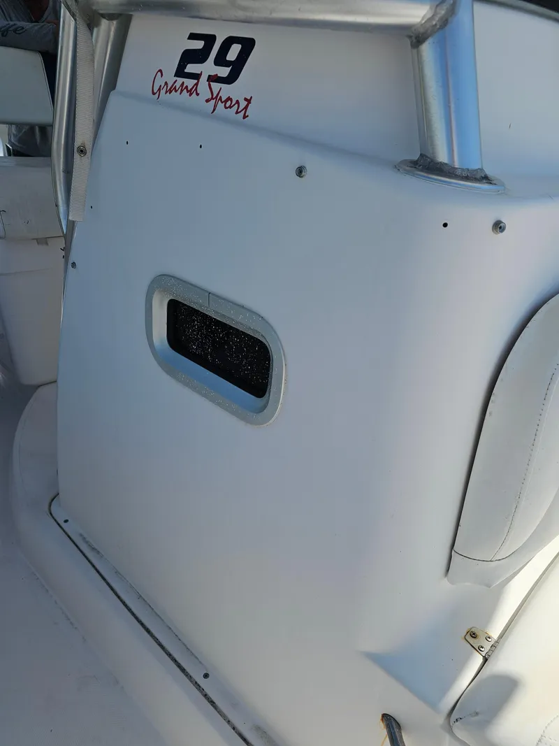 Slide: The Image of 2008 Pro-Line 29 Grande Sport boat interior detail with logo and seating. - 12