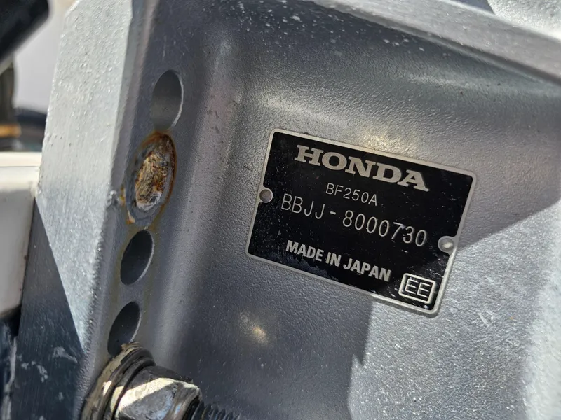 Slide: The Image of Close-up of a Honda BF250A engine plate on a 2008 Pro-Line 29 Grande Sport. - 19