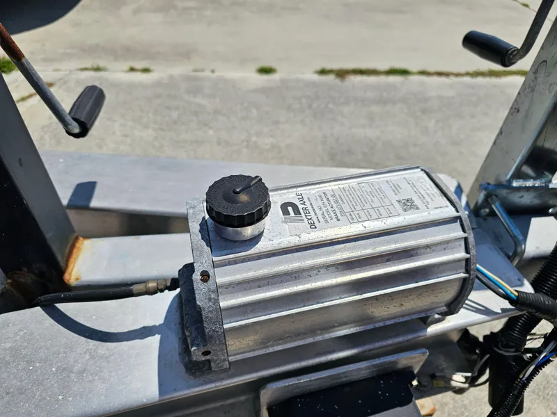 Slide: The Image of Close-up of a Dexter Axle component on a 2008 Pro-Line 29 Grande Sport boat. - 23