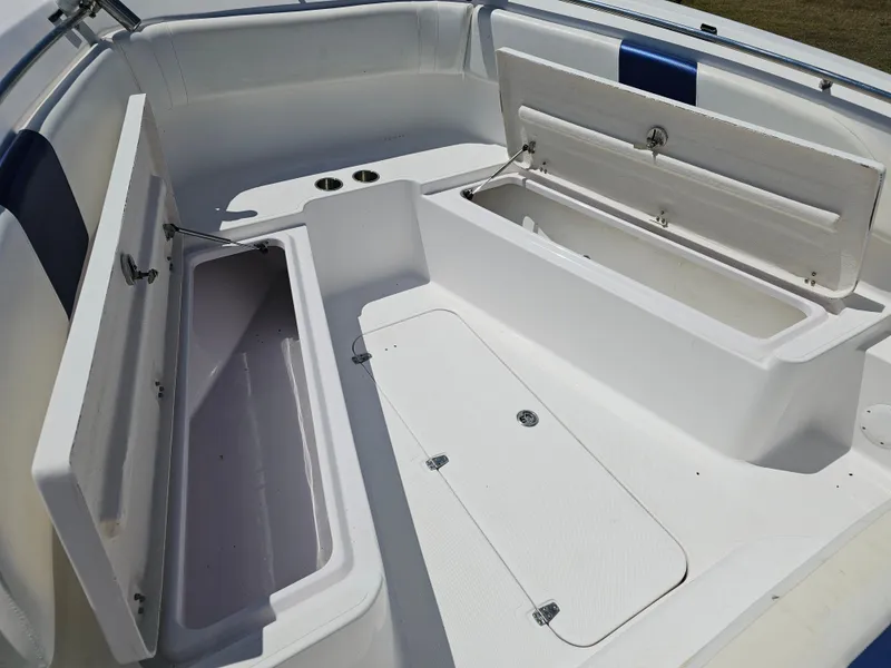 Slide: The Image of 2008 Pro-Line 29 Grande Sport boat interior with open storage compartments. - 3