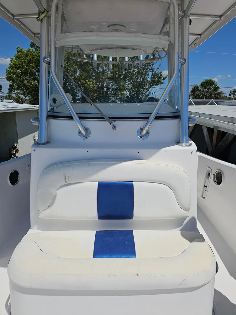 Slide: The Image of 2008 Pro-Line 29 Grande Sport boat interior with blue and white seating. - 33