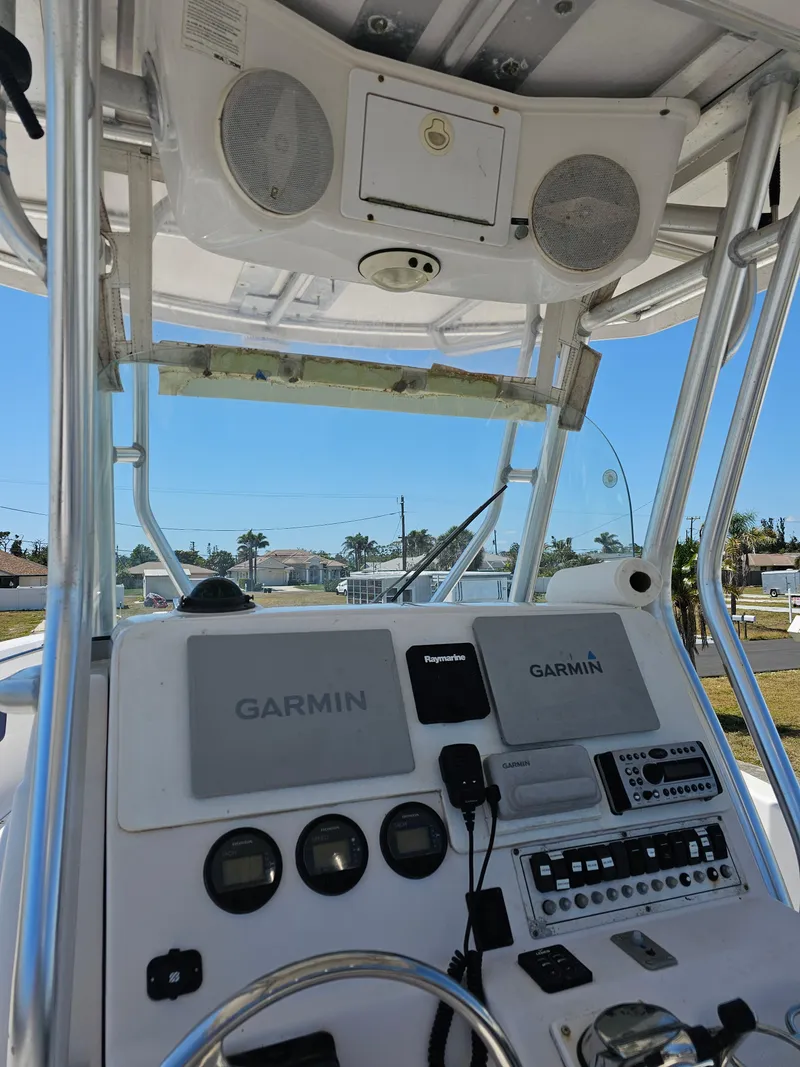 Slide: The Image of 2008 Pro-Line 29 Grande Sport boat dashboard with Garmin navigation systems and controls. - 38