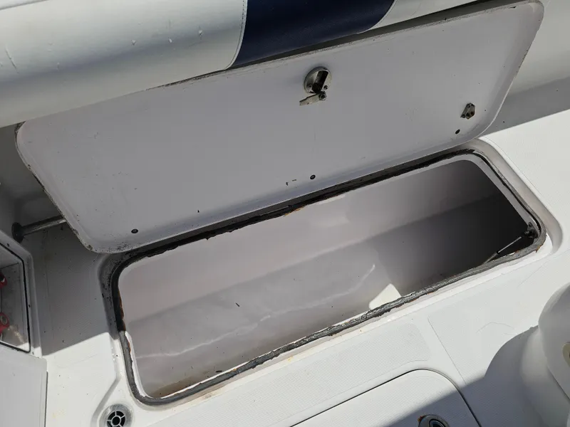 Slide: The Image of Open storage compartment on 2008 Pro-Line 29 Grande Sport boat. - 49