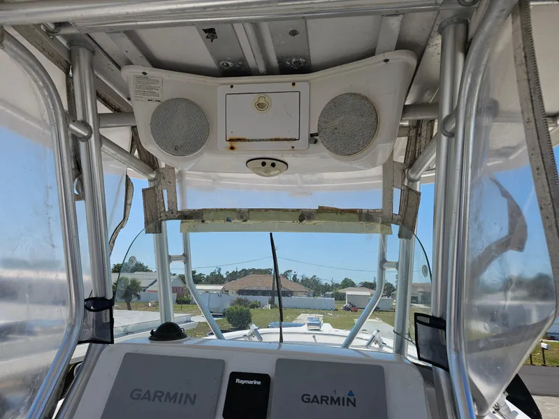 Slide: The Image of 2008 Pro-Line 29 Grande Sport boat interior with Garmin navigation system and speakers. - 8