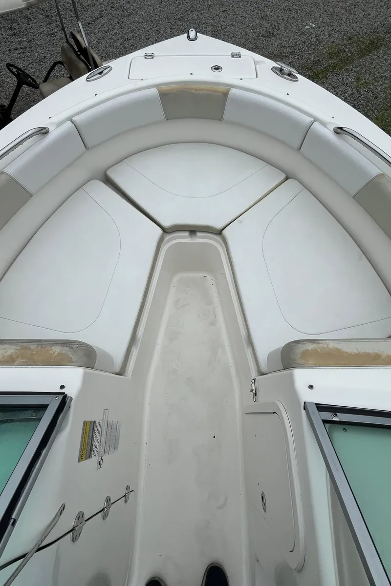 Slide: The Image of 2016 Robalo R227 Dual Console boat, white interior, bow seating area. - 12
