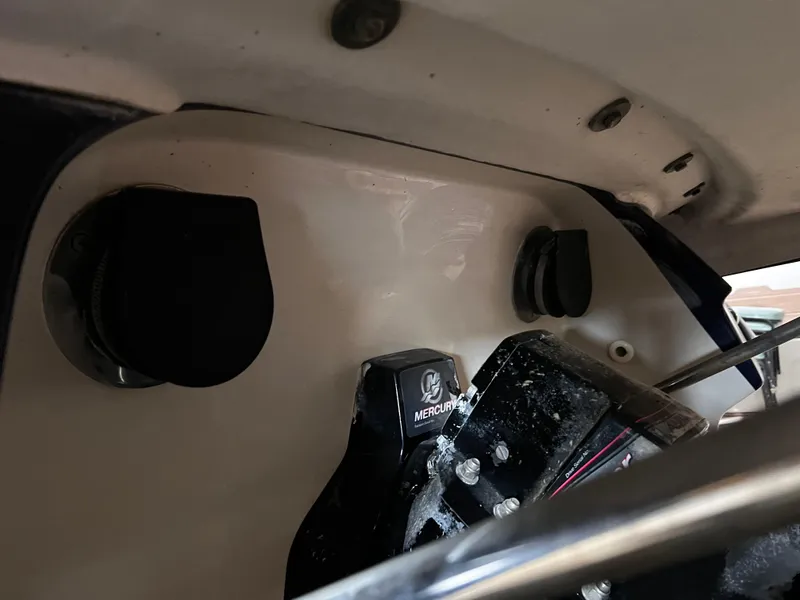 Slide: The Image of 2008 Monterey 214FSC boat engine compartment with Mercury components visible. - 12