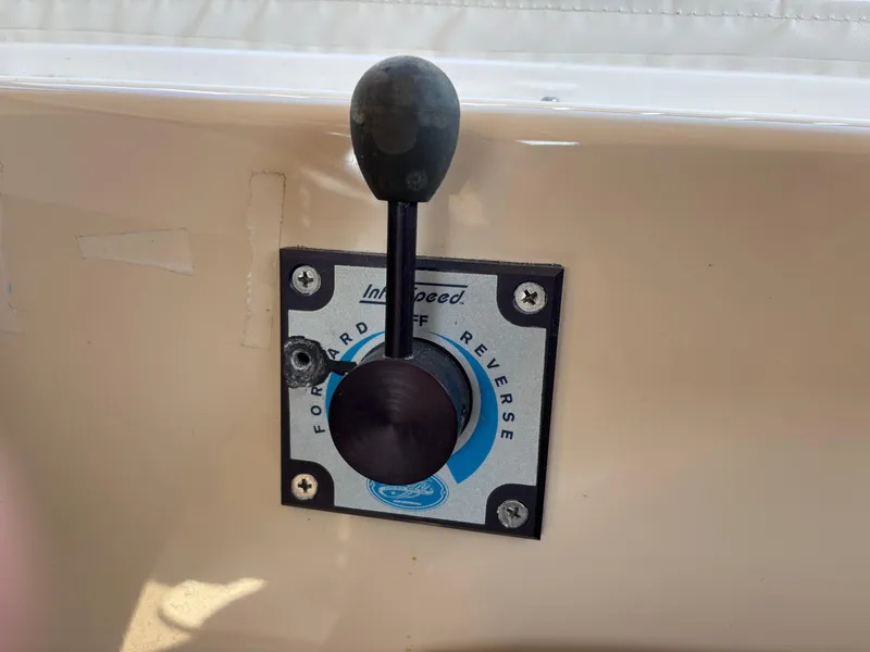 Slide: The Image of Throttle control lever on a 2009 Duffy Snug Harbor boat, showing forward and reverse settings. - 10