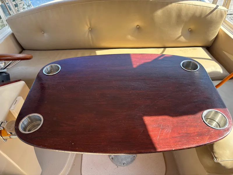Slide: The Image of Wooden table with cup holders on a 2009 Duffy Snug Harbor boat. - 7
