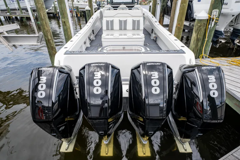 Slide: The Image of 2022 Invincible 39 Open Fisherman with four Mercury 300 engines docked at marina. - 15