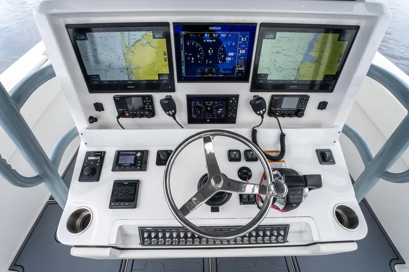 Slide: The Image of 2022 Invincible 39 Open Fisherman dashboard with advanced navigation and control systems. - 17