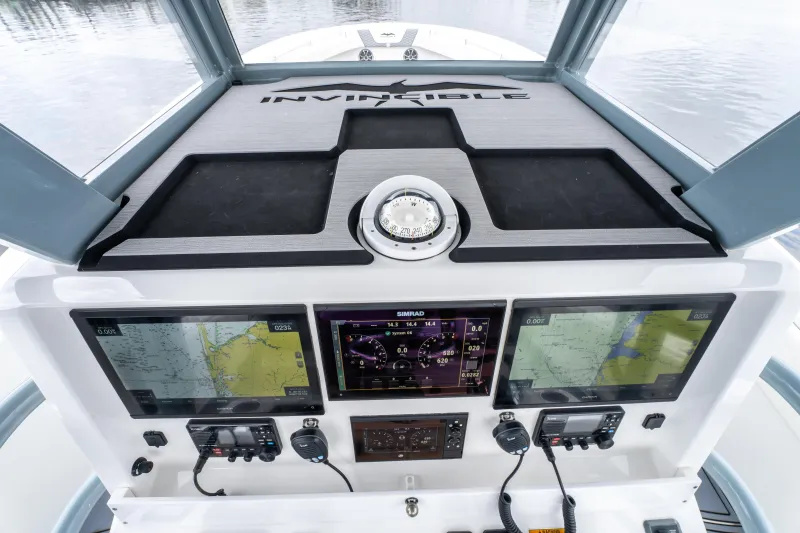 Slide: The Image of 2022 Invincible 39 Open Fisherman dashboard with advanced navigation and control systems. - 18