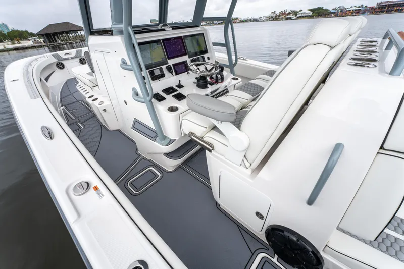 Slide: The Image of 2022 Invincible 39 Open Fisherman boat interior with advanced navigation controls. - 19