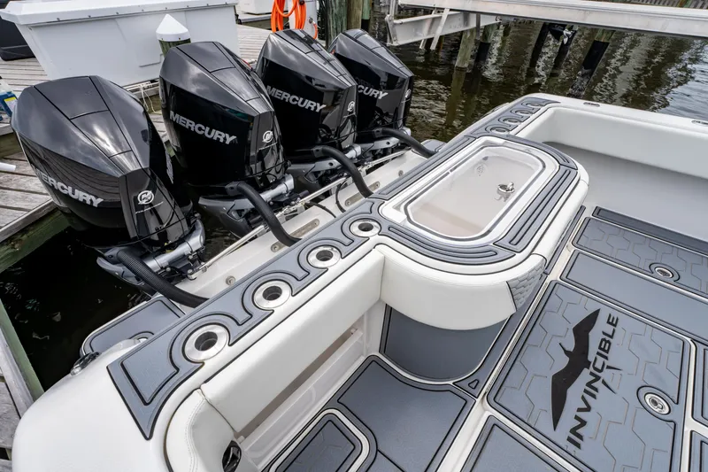 Slide: The Image of 2022 Invincible 39 Open Fisherman with four Mercury engines at a dock. - 23