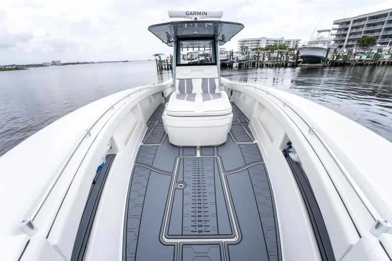 Slide: The Image of 2022 Invincible 39 Open Fisherman boat with sleek deck design, docked by the waterfront. - 34