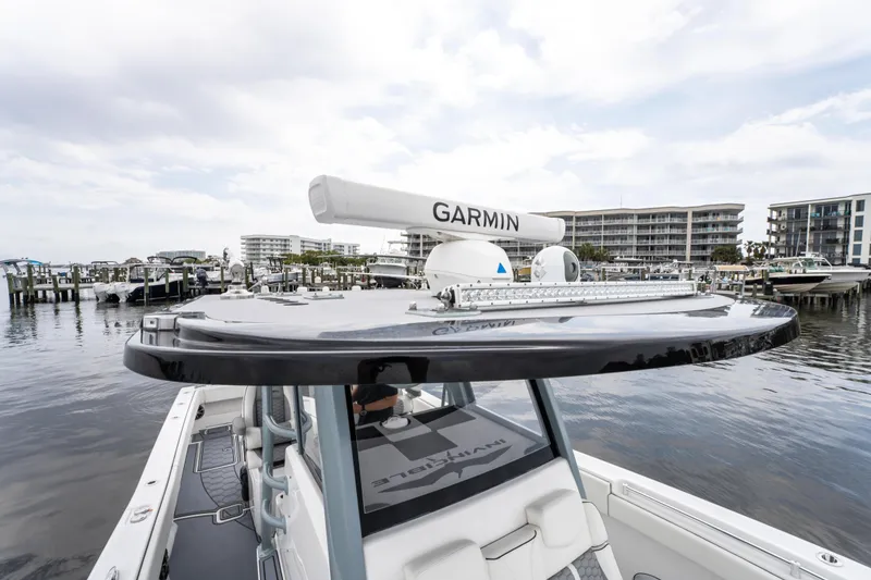 Slide: The Image of 2022 Invincible 39 Open Fisherman boat with Garmin radar, docked in a marina. - 36