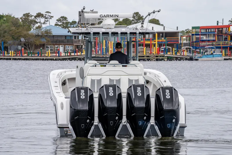 Slide: The Image of 2022 Invincible 39 Open Fisherman boat with four powerful engines on the water. - 8