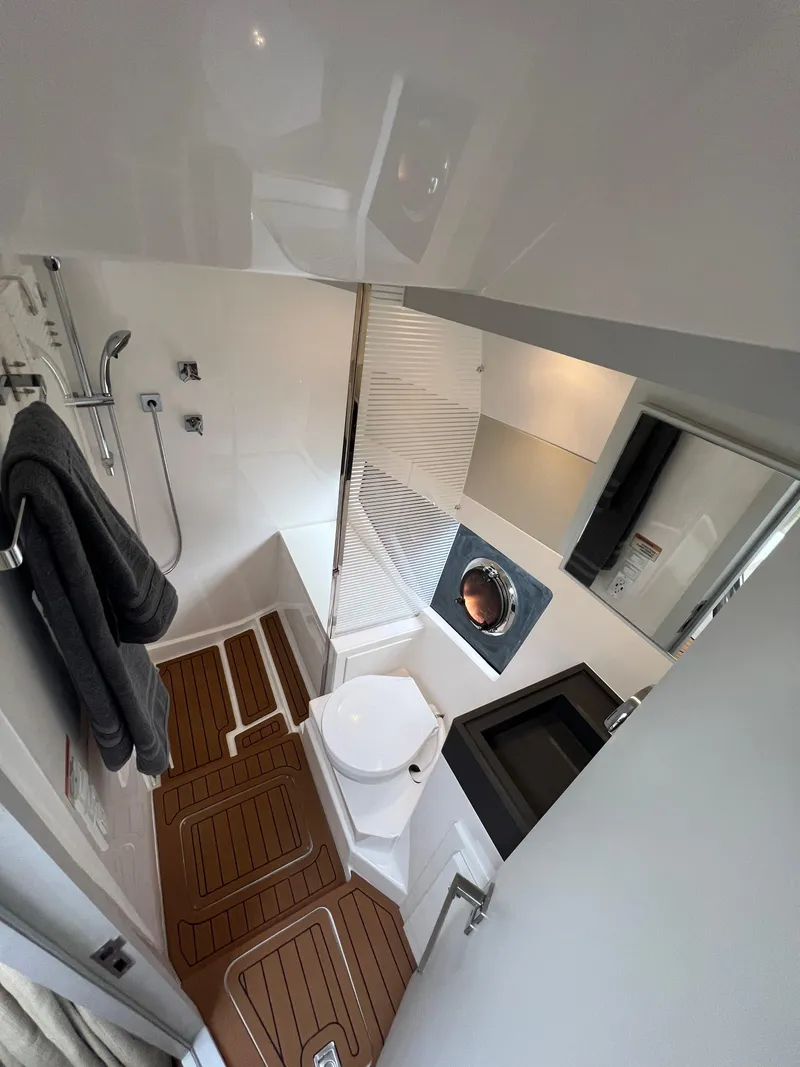 Slide: The Image of Modern bathroom in 2023 Evolve 400HT yacht with sleek fixtures and wooden flooring. - 20