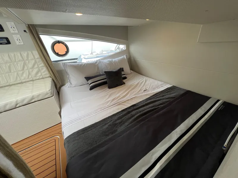 Slide: The Image of Luxurious cabin interior of 2023 Evolve 400HT yacht with elegant bedding and modern design. - 21