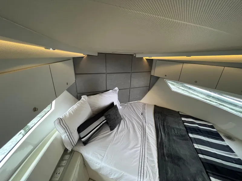 Slide: The Image of Luxurious bedroom interior of 2023 Evolve 400HT yacht with modern design and ambient lighting. - 24