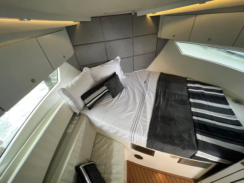 Slide: The Image of Luxurious interior cabin of 2023 Evolve 400HT yacht with modern bedding and sleek design. - 25