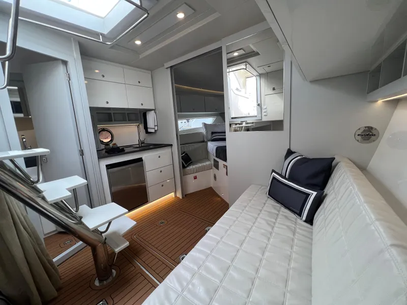Slide: The Image of Luxurious interior of 2023 Evolve 400HT yacht with modern kitchen and cozy seating area. - 27