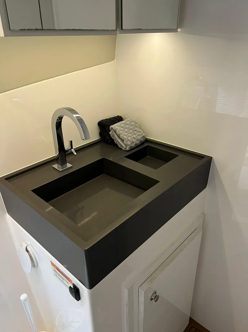 Slide: The Image of Modern sink with sleek faucet in 2023 Evolve 400HT model, featuring minimalist design. - 28