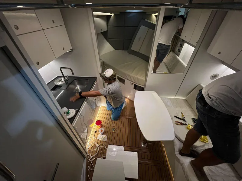 Slide: The Image of Interior of 2023 Evolve 400HT yacht with modern kitchen and seating area. - 6