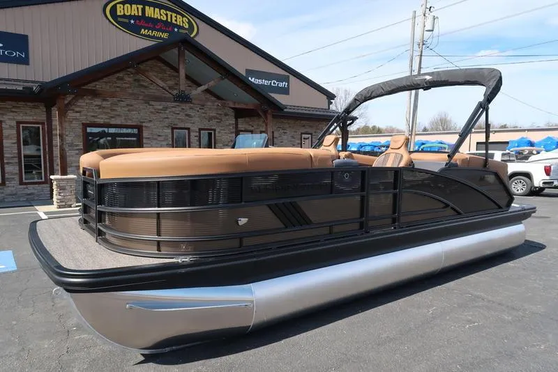 Slide: The Image of 2025 Bennington M Quad Bench 22 MFB pontoon boat at dealership. - 1