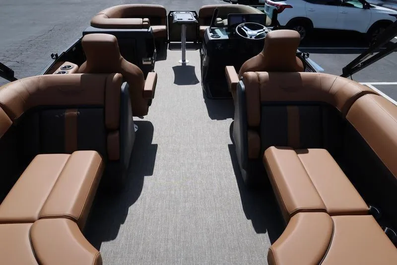 Slide: The Image of 2025 Bennington M Quad Bench 22 MFB interior with luxurious tan seating and modern design. - 13