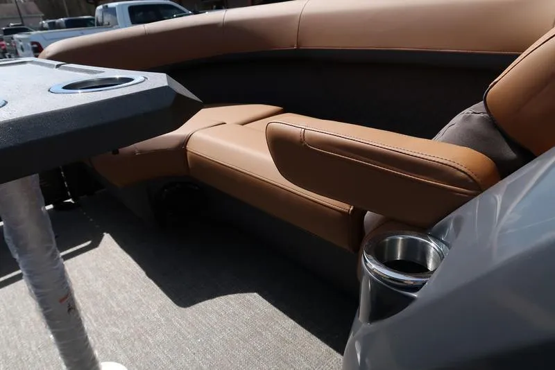 Slide: The Image of Luxurious seating on 2025 Bennington M Quad Bench 22 MFB with cup holders and table. - 17