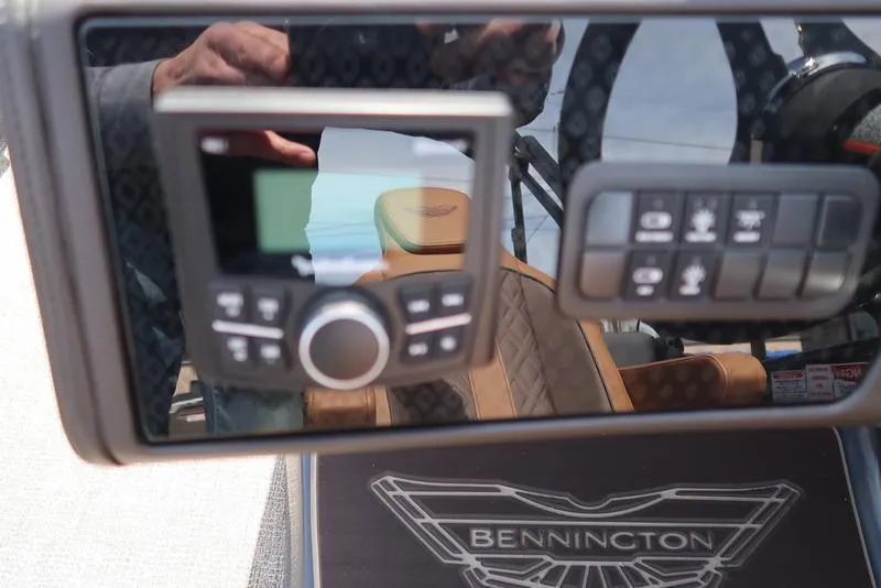 Slide: The Image of Control panel of 2025 Bennington M Quad Bench 22 MFB boat interior. - 29