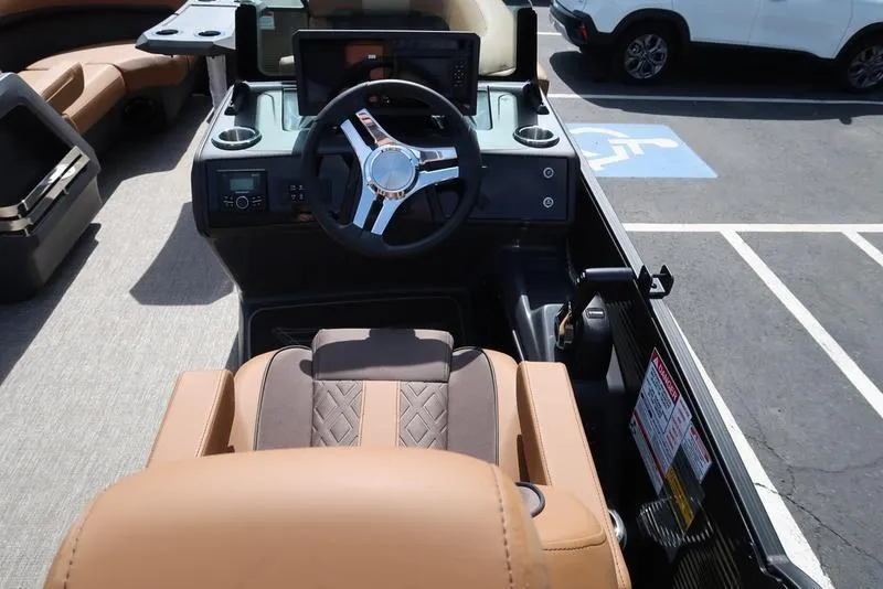 Slide: The Image of Captain's seat and helm of 2025 Bennington M Quad Bench 22 MFB pontoon boat. - 31