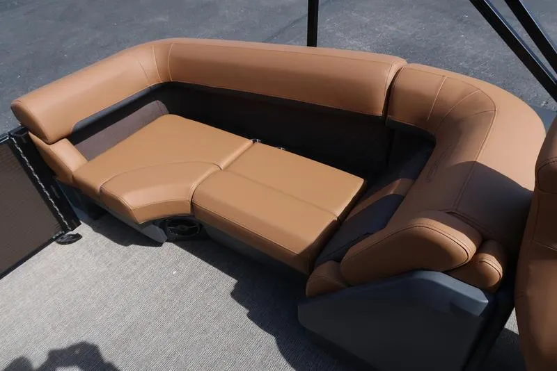 Slide: The Image of 2025 Bennington M Quad Bench 22 MFB with tan leather seating on a boat deck. - 33