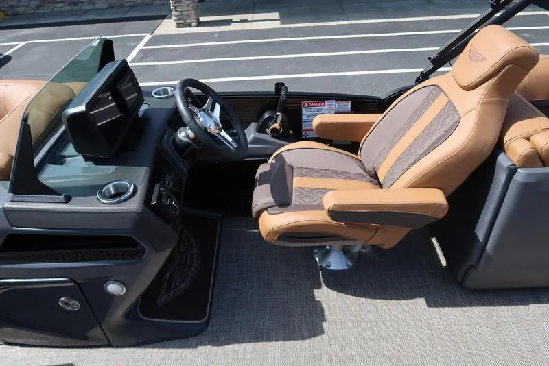 Slide: The Image of Luxurious interior of 2025 Bennington M Quad Bench 22 MFB boat with premium seating and dashboard. - 34