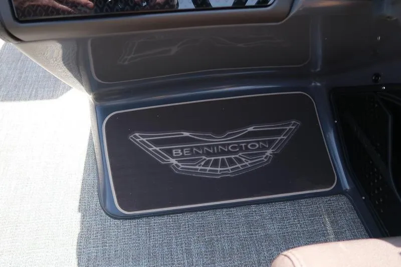 Slide: The Image of Bennington M Quad Bench 22 MFB 2025 logo on boat interior flooring. - 40