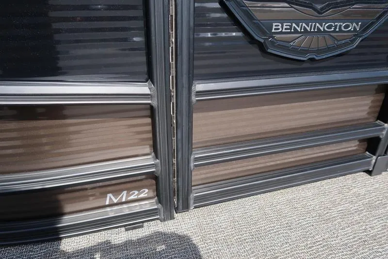 Slide: The Image of 2025 Bennington M Quad Bench 22 MFB, close-up of exterior detailing. - 9