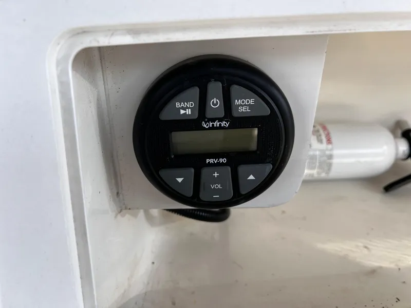 Slide: The Image of Infinity PRV-90 marine stereo control on 2001 Aquasport 190 Osprey boat dashboard. - 11