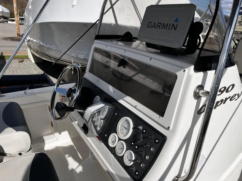 Slide: The Image of 2001 Aquasport 190 Osprey boat dashboard with Garmin navigation system. - 4