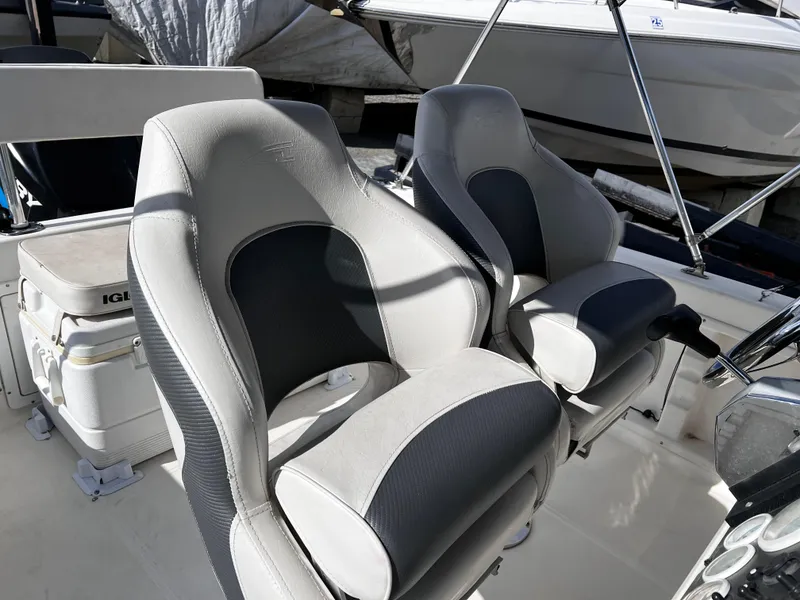 Slide: The Image of 2001 Aquasport 190 Osprey boat interior with two cushioned seats. - 5