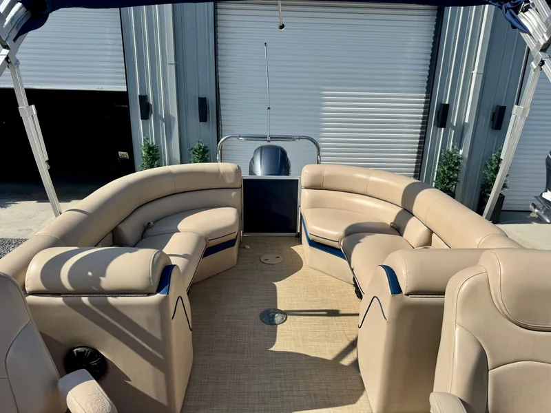Slide: The Image of 2018 South Bay 500 Series 2.75 pontoon boat with beige seating and spacious interior. - 5