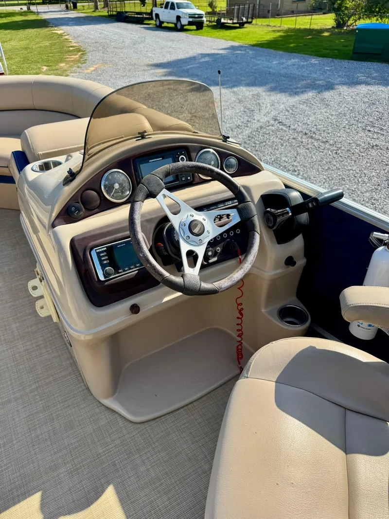 Slide: The Image of 2018 South Bay 500 SERIES 2.75 boat dashboard with steering wheel and controls. - 8