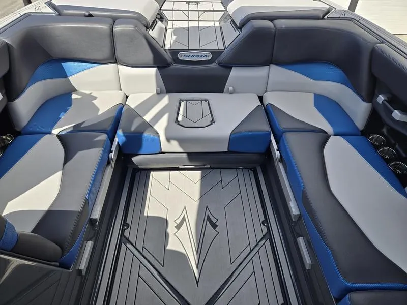 Slide: The Image of 2019 Supra SA boat interior with blue and gray seating, stylish design. - 10