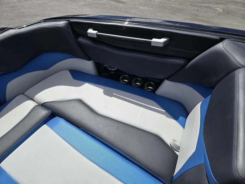 Slide: The Image of 2019 Supra SA boat interior with blue and gray seating, showcasing modern design. - 14